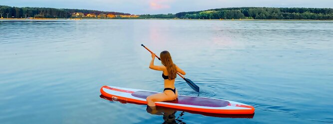 Trip Ferienhaus - Wassersport mit Balance & Technik vereinen | Stand up paddeln, SUPen, Surfen, Skiten, Wakeboarden, Wasserski auf kristallklaren Bergseen